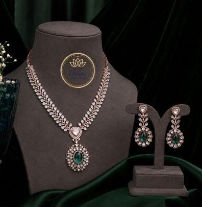 Divine Jewellery 92.5 Silver Rose Gold Plated American Diamond Necklace Set with Emerald Green Teardrop Stone Pendant & Matching Earrings