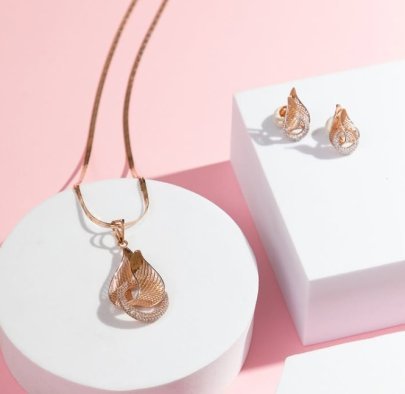 Divine Jewellery Elegant Twisted Leaf Designer Pendant Necklace Set with Crystal Mesh Detailing